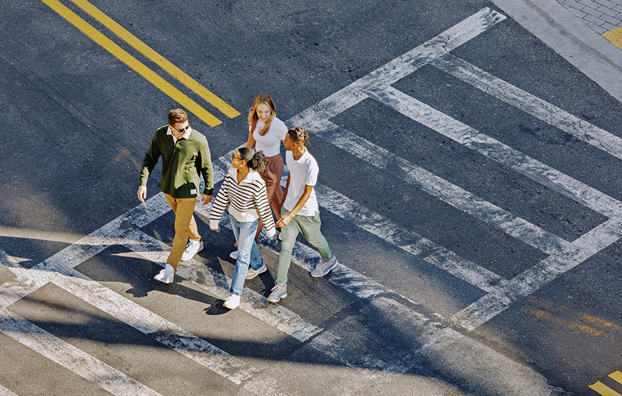 Friends crossing a street