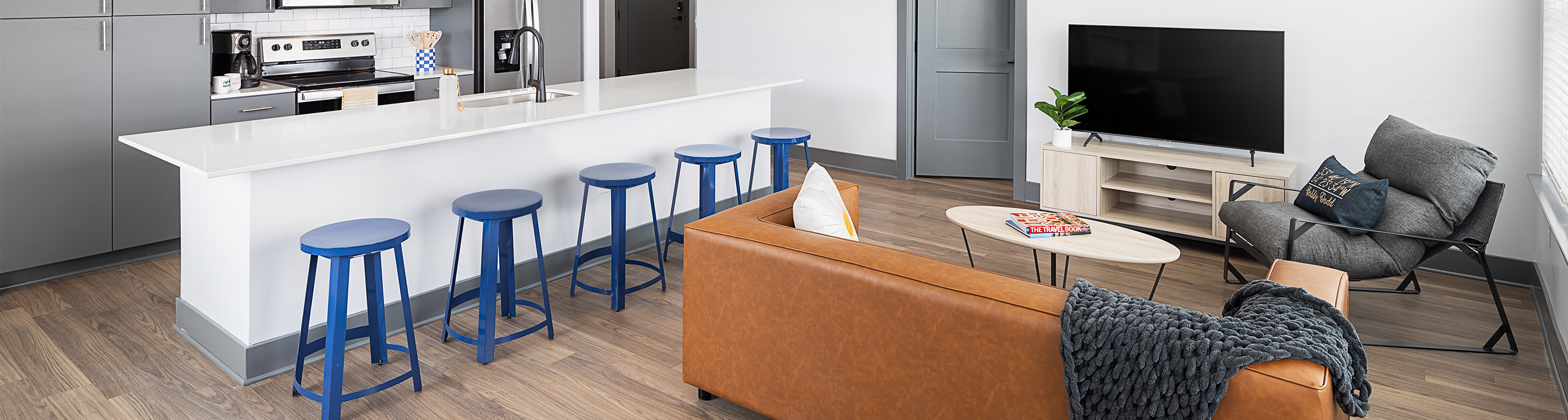 A living room with an orange couch