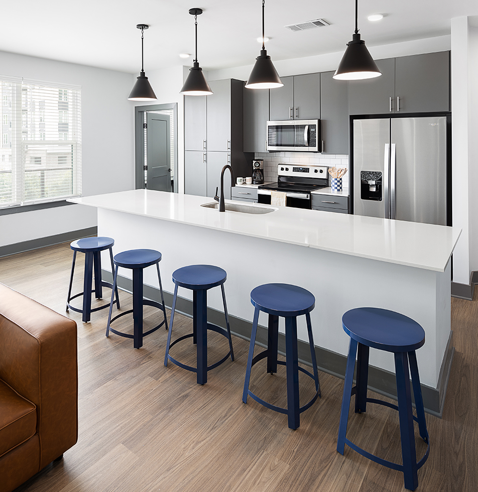 Kitchen with blue stools