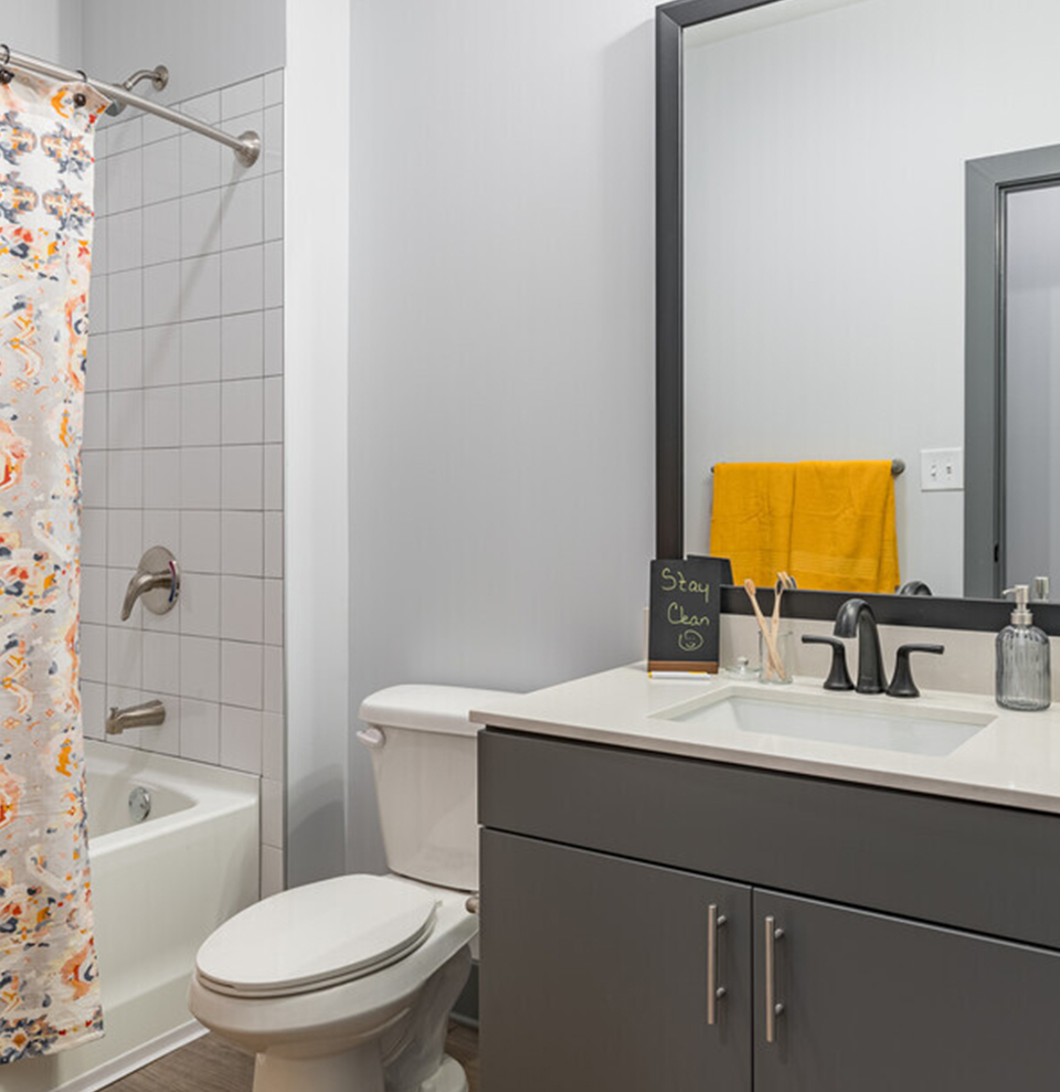 A bathroom with a bathtub and shower